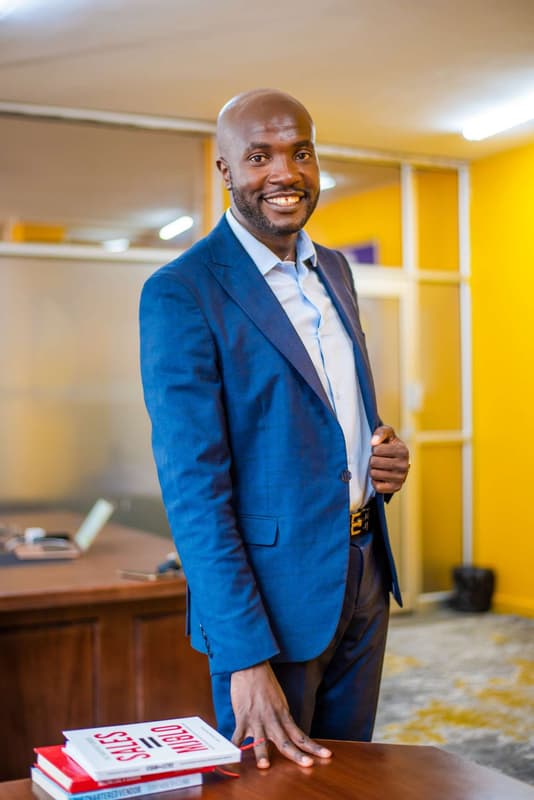 Jerry Nyazungu: Portrait, blue suit